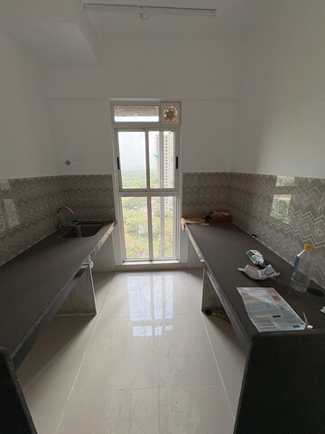 Kitchen in 2 BHK Apartment at Lodha Codename Premier, Mangaon – for Rent