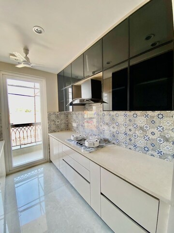 Kitchen in 3.5 BHK Apartment at Godrej Meridien, Sector 106 – for Sale