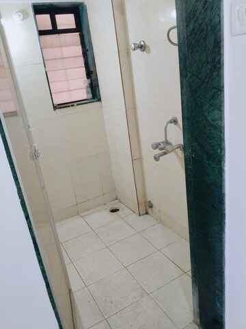 Bathroom in 1 BHK Apartment at Puranik City, Kasarvadavali – for Rent
