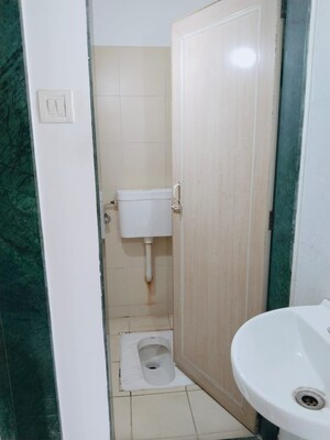 Bathroom in 1 BHK Apartment at Puranik City, Kasarvadavali – for Rent