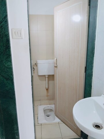 Bathroom in 1 BHK Apartment at Puranik City, Kasarvadavali – for Rent