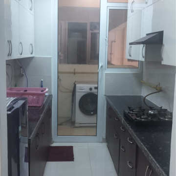 Kitchen in 2.5 BHK Apartment at Mahagun Mirabella, Sector 79 – for Rent