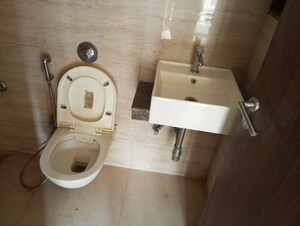 Bathroom in 1 BHK Apartment at Sunteck West World Phase 2 Tivri, Naigaon East – for Rent