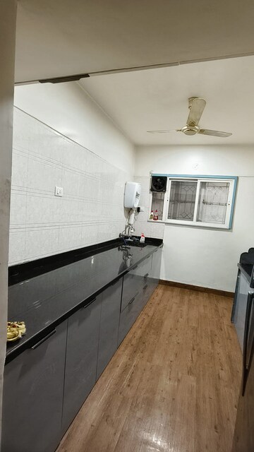 Kitchen in 2 BHK Apartment at Naiknavare Gardenia Society Phase 1, Wadgaon Sheri – for Rent