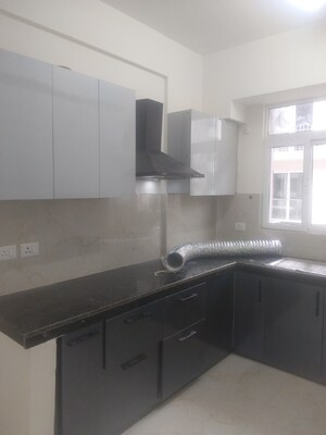 Kitchen in 2.5 BHK Apartment at Smart World Gems, Sector 89 – for Rent