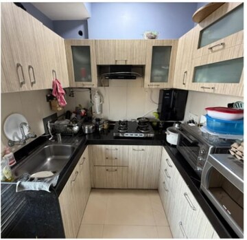 Kitchen in 2 BHK Apartment at Gundecha Symphony, Andheri West – for Sale
