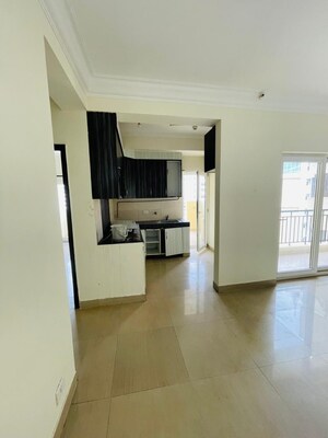 Living Room in 2 BHK Apartment at Paramount Floraville, Sector 137 – for Sale