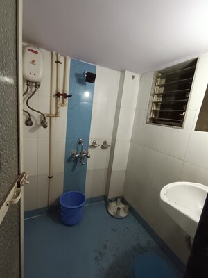 Bathroom in 1 BHK Apartment at Bindra Marigold CHS, Andheri East – for Sale