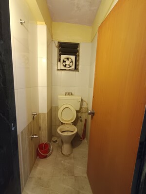 Bathroom in 1 BHK Apartment at Bindra Marigold CHS, Andheri East – for Sale