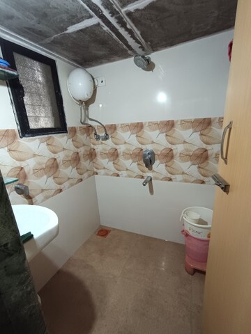 Living Room in 1 BHK Apartment at Bindra Marigold CHS, Andheri East – for Sale