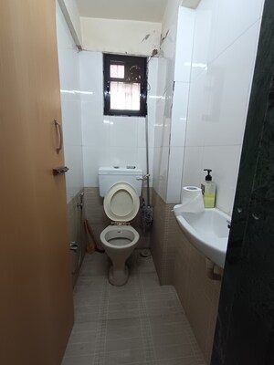 Bathroom in 1 BHK Apartment at Bindra Marigold CHS, Andheri East – for Sale