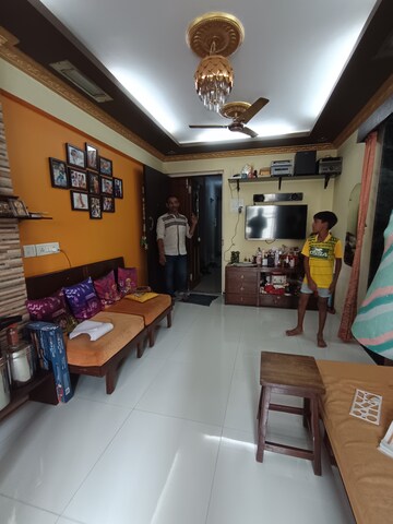 Living Room in 1 BHK Apartment at Bindra Marigold CHS, Andheri East – for Sale