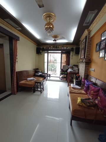 Living Room in 1 BHK Apartment at Bindra Marigold CHS, Andheri East – for Sale