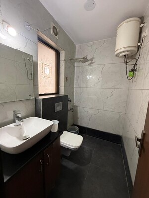 Bathroom in 3 BHK Apartment at Paschim Vihar – for Rent