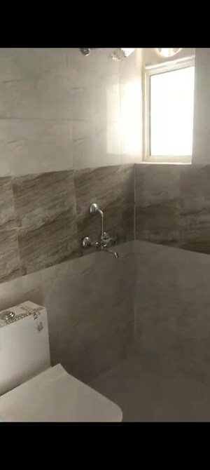 Bathroom in 4 BHK Apartment at Proview Officer City, Raj Nagar Extension – for Rent