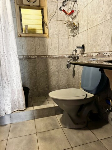 Bathroom in 2 BHK Apartment at Embassy Habitat, Palace Road – for Sale