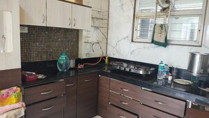 Kitchen in 2 BHK Apartment at Majestique Landmark Miami, Dhayari – for Rent