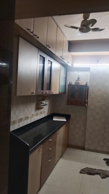 Kitchen in 3 BHK Apartment at Riddhi Tower, Malad East – for Rent