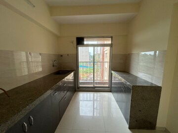 Kitchen in 1 BHK Apartment at Metropolis Rivera, Kasarvadavali – for Rent