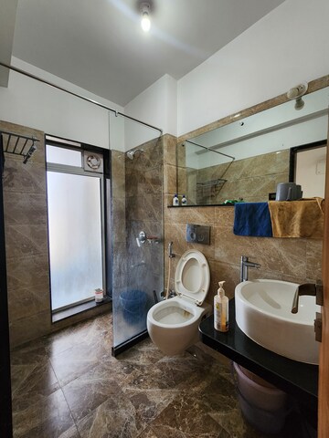 Bathroom in 2 BHK Apartment at Whispering Woods, Kandivali East – for Rent