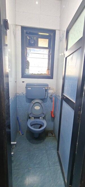 Bathroom in 1 BHK Apartment at Natwardham CHS, Malad West – for Rent