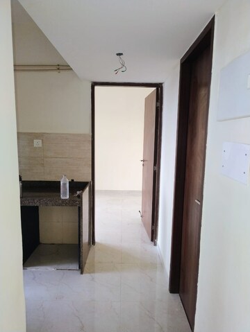 Living Room in 1 BHK Apartment at Sunteck West World, Tivri – for Rent