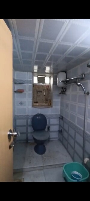 Bathroom in 2 BHK Apartment at Parivar CHS Santacruz West, Santacruz West – for Sale