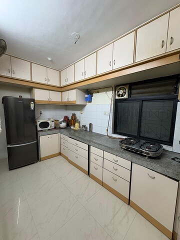 Kitchen in 2 BHK Apartment at Shree Saraswati Apartment, Dhankawadi – for Rent
