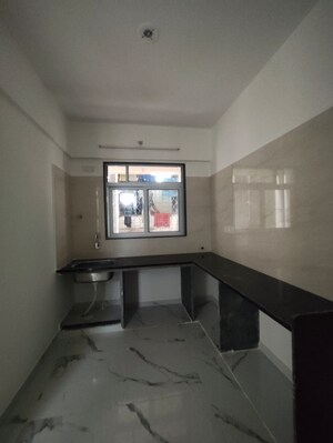 Kitchen in 1.5 BHK Apartment at Thane West – for Sale