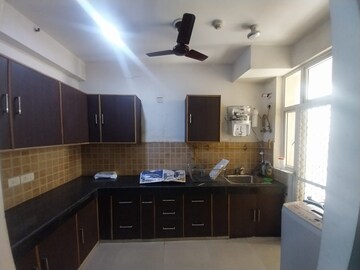 Kitchen in 3 BHK Apartment at Mahagun Mywoods, Sector 16c Greater Noida – for Rent