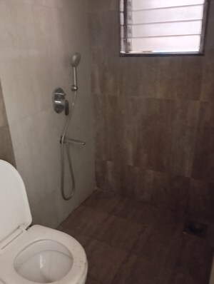 Bathroom in 2 BHK Apartment at N Woods Trishna View, Andheri East – for Sale