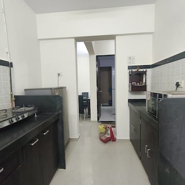 Kitchen in 2 BHK Apartment at Damji Shamji Kalpvruksha Tulip, Kasarvadavali – for Rent