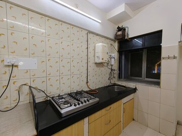 Kitchen in 2 BHK Apartment at Green Acres Apartment, Waghbil – for Rent