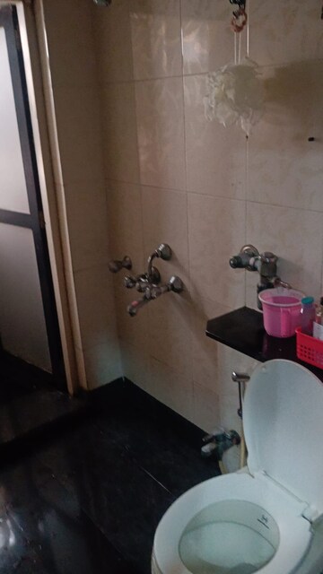 Bathroom in 1 BHK Apartment at K Raheja Palm Court, Malad West – for Rent