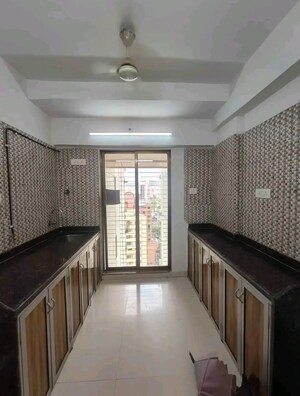 Kitchen in 3 BHK Apartment at New India Grace Luxuria, Malad West – for Rent