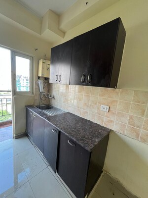 Kitchen in 3 BHK Apartment at Amrapali Silicon City, Sector 76 – for Rent