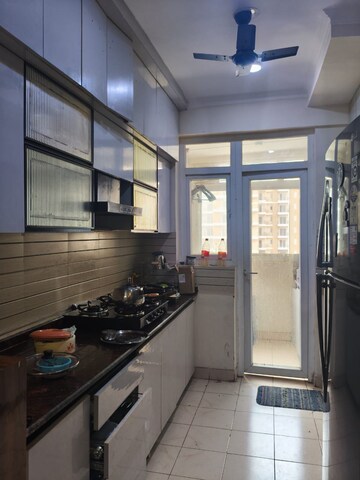 Kitchen in 3 BHK Apartment at Amrapali Crystal Homes, Sector 76 – for Rent