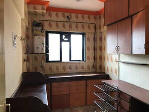 Kitchen in 2 BHK Apartment at Gokuldham Saidham CHS, Goregaon East – for Rent