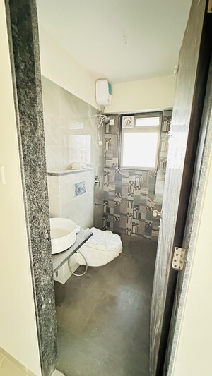 Bathroom in 2 BHK Apartment at Charkop Industrial Estate – for Sale