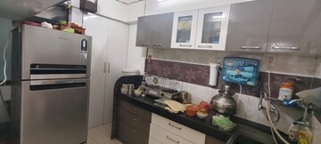 Kitchen in 1 BHK Apartment at New Gurukripa CHS, Vishnu Nagar – for Sale