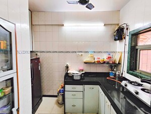 Kitchen in 2 BHK Apartment at Eden Woods complex, Manpada – for Sale