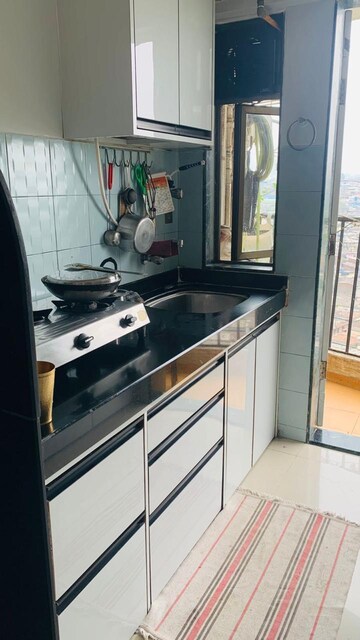 Kitchen in 2.5 BHK Apartment at Everest World Morning Glory CHS Ltd, Kolshet Road – for Sale