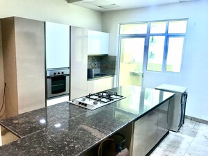 Kitchen in 4 BHK Apartment at Mahagun Mezzaria, Sector 78 – for Rent