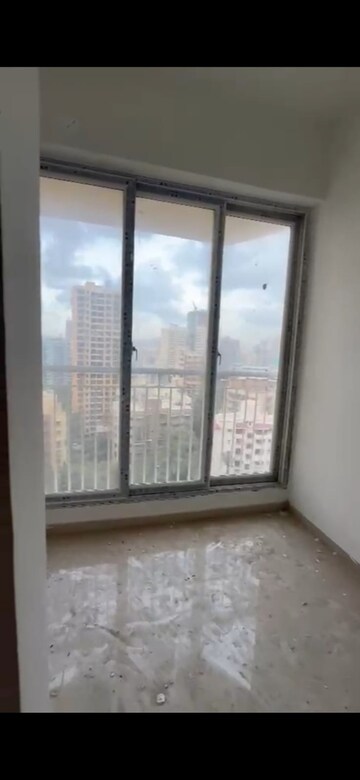 Room in 2.5 BHK Apartment at Ruparel Palacio Phase 1, Kandivali West – for Sale