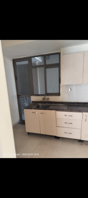 Kitchen in 2 BHK Apartment at Unitech Uniworld Gardens 2, Sector 47 – for Rent