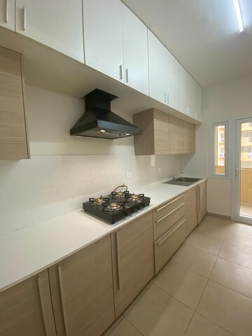 Kitchen in 2.5 BHK Apartment at Bhartiya City Nikoo Homes II, Thanisandra Main Road – for Rent