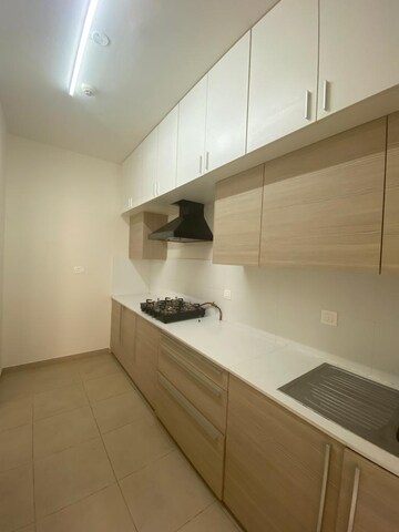 Kitchen in 2.5 BHK Apartment at Bhartiya City Nikoo Homes II, Thanisandra Main Road – for Rent
