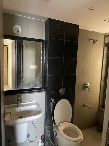 Bathroom in 1 BHK Apartment at Puranik City Phase III, Ghodbunder Road – for Rent