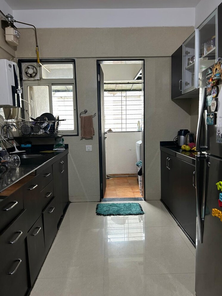 Kitchen, gini-viviana 2 Bedroom 855 Sq.Ft. Apartment In Balewadi Pune 9287783