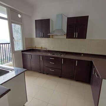 Kitchen in 3 BHK Apartment at Amrapali Platinum, Sector 119 – for Sale